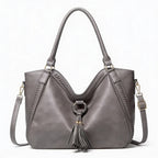 Vera | Women’s Crossbody Bag With Tassel Accent And Bold Stitch Detailing | Modern